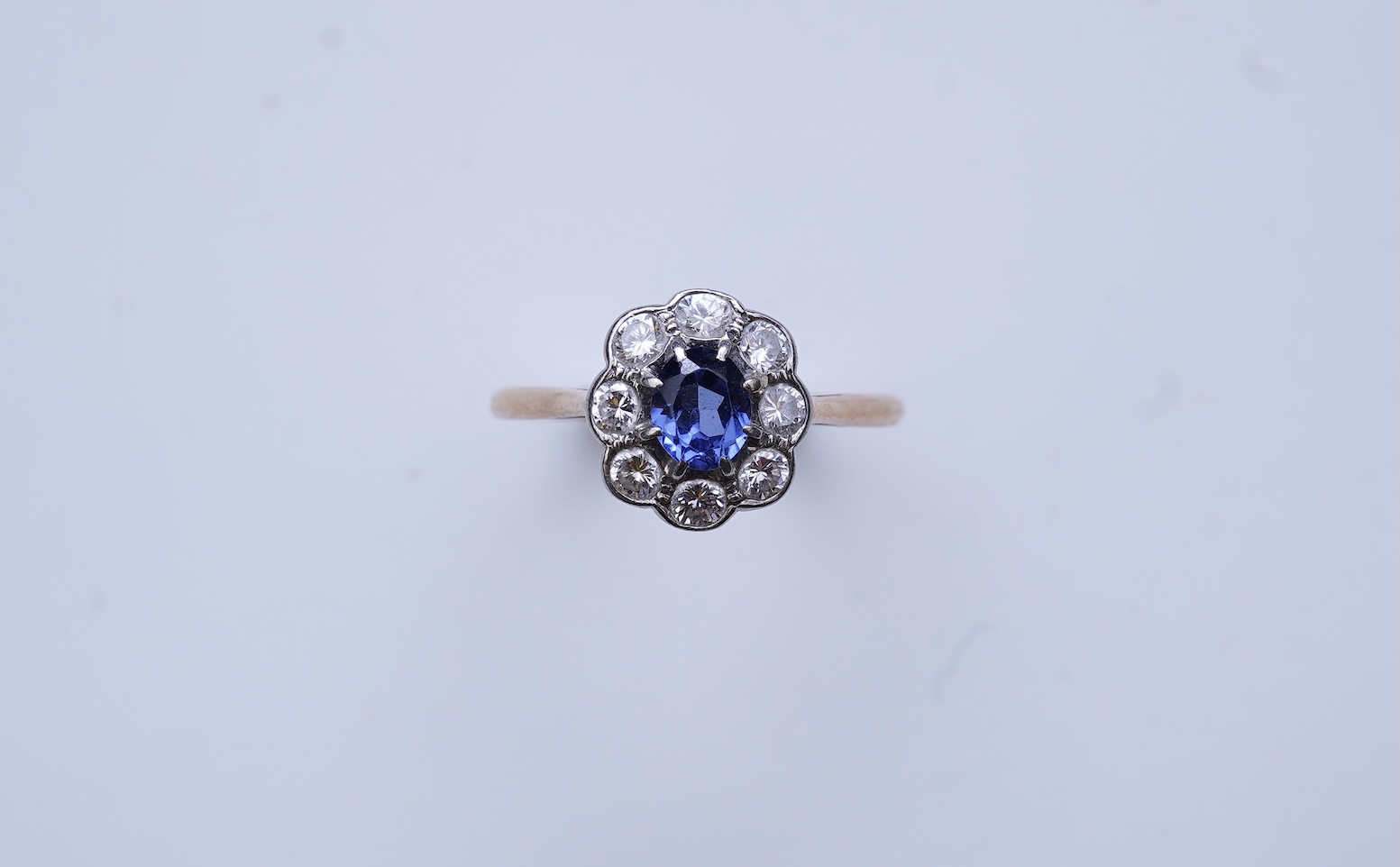 A synthetic sapphire and diamond ring